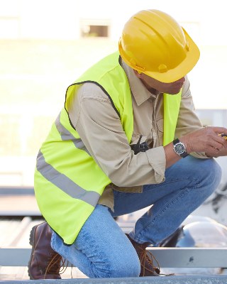 Technician servicing an outdoor HVAC unit